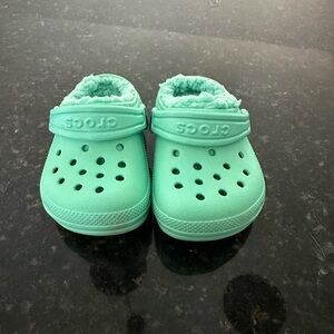 Fuzzy teal Crocs
